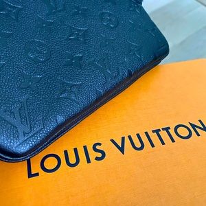 Black and gold Louis Vuitton Double zip clutch.